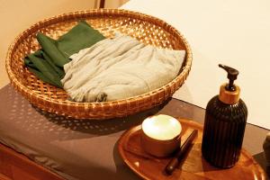 a wicker basket sitting on top of a table at Thanicha Resort Amphawa in Amphawa +97 photos
