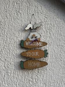 a sign that says welcome to our home at Restaurant Hammer Highway-Grill in Lucerne