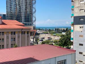 a view of a city with buildings and the ocean at Apartment In Batumi MGZAVREBI in Batumi