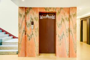 Fotografie z fotogalerie ubytování Super Townhouse Mysore Central v destinaci Maisúr