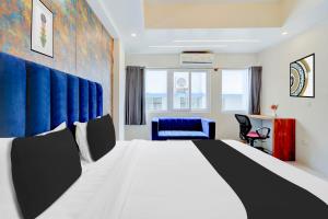 Voodi või voodid majutusasutuse Super Townhouse Mysore Central toas