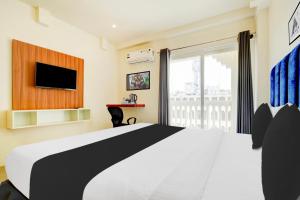 Voodi või voodid majutusasutuse Super Townhouse Mysore Central toas