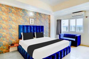 Voodi või voodid majutusasutuse Super Townhouse Mysore Central toas