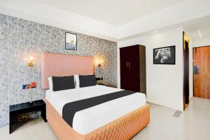 Voodi või voodid majutusasutuse Super Townhouse Mysore Central toas