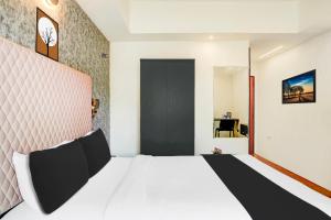 Voodi või voodid majutusasutuse Super Townhouse Mysore Central toas