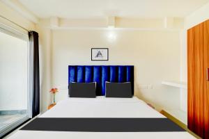 Voodi või voodid majutusasutuse Super Townhouse Mysore Central toas