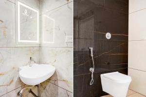 Vannituba majutusasutuses Super Townhouse Mysore Central
