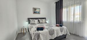 Ένα ή περισσότερα κρεβάτια σε δωμάτιο στο Bella Nina Apartments