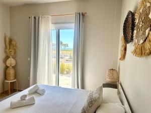Posteľ alebo postele v izbe v ubytovaní Boho Nomad Seaview Detached House