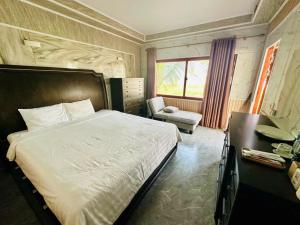 Ένα ή περισσότερα κρεβάτια σε δωμάτιο στο Ruby Star Quỳnh Resort