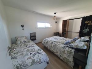 Postel nebo postele na pokoji v ubytování Logement indépendant proche circuit 24h Le Mans