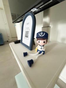a lego figurine of a police officer sitting on a counter at Suite Tra il Centro e il Mare,Vicino Stazione in Savona