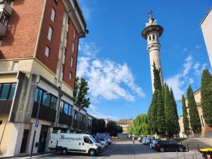 a street with a pole with a van parked next to a building at Affittacamere38B in Pordenone