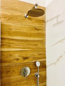 a bathroom with a shower with a wooden counter top at Domus Lucia in Syracuse +42 photos