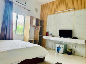 Μια τηλεόραση ή/και κέντρο ψυχαγωγίας στο Ruby Star Quỳnh Resort