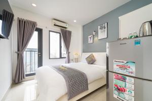 Ένα ή περισσότερα κρεβάτια σε δωμάτιο στο Golden Sun 3 Apartment