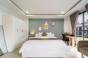 Ένα ή περισσότερα κρεβάτια σε δωμάτιο στο Golden Sun 3 Apartment +94 φωτογραφίες