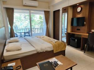 Postel nebo postele na pokoji v ubytování Hotel Shreyas