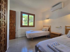 Ένα ή περισσότερα κρεβάτια σε δωμάτιο στο Rayo de Sol Beautiful bungalow with sea view +57 φωτογραφίες