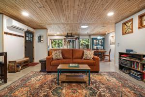 a living room with a couch and a table at Little Blue in Bellingham