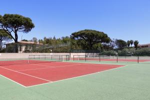 a tennis court with two tennis rackets on it at Splendid 3-bedroom villa for 6 people in Saint-Tropez