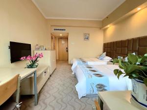 TV a/nebo společenská místnost v ubytování Chongqing Milky Way Hotel