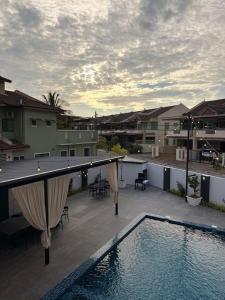 a swimming pool on the roof of a house at Fairy 2 Pool Villa 22 Pax Karaoke & Huge Event Space in Ipoh