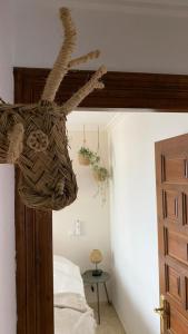 a basket hanging from the ceiling of a bedroom at Casa el Montcel, a unique chalet with roofterrace and shared pool in Denia +47 photos