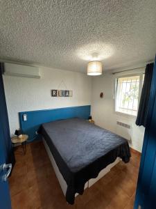 Posteľ alebo postele v izbe v ubytovaní Corse Appartement Sognu di Mar Marine de Bravonne à Linguizzetta