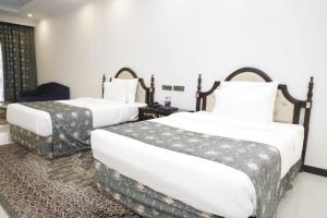 Mayfair Spring Valley Resort Guwahati客房内的一张或多张床位