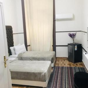 Voodi või voodid majutusasutuse Hotel velvet One toas