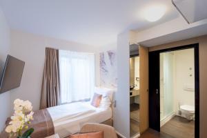 Letto o letti in una camera di Cascada Boutique Hotel