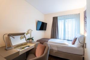 Letto o letti in una camera di Cascada Boutique Hotel