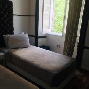 Voodi või voodid majutusasutuse Hotel velvet One toas