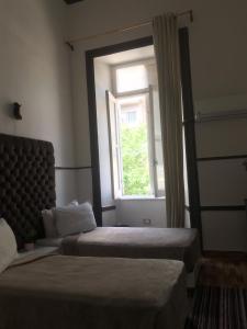 Voodi või voodid majutusasutuse Hotel velvet One toas