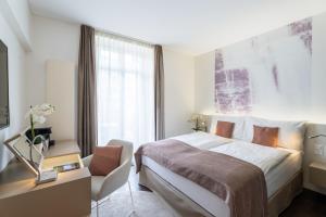 Letto o letti in una camera di Cascada Boutique Hotel