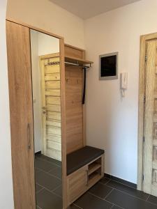 a bathroom with a mirror and a closet at Apartment Mali raj in Medulin