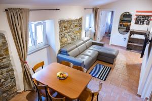 a living room with a couch and a table at Jazz Apartments in Piran