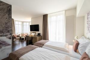 Letto o letti in una camera di Cascada Boutique Hotel