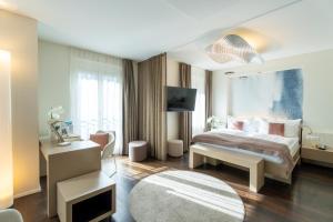 Letto o letti in una camera di Cascada Boutique Hotel