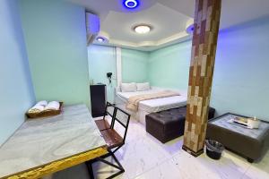 Ένα ή περισσότερα κρεβάτια σε δωμάτιο στο Bankhunchang Guest House บ้านขุนช้างห้องพักรายวันรามคำแหง