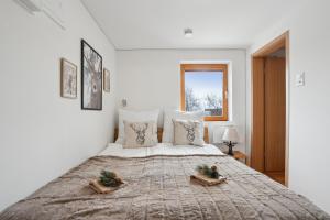 Postelja oz. postelje v sobi nastanitve INN JOY Apartments - idyllische Bergsicht