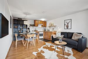 Kuhinja oz. manjša kuhinja v nastanitvi INN JOY Apartments - idyllische Bergsicht