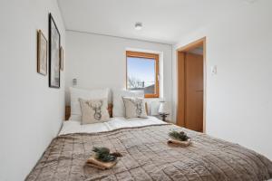 Postel nebo postele na pokoji v ubytování INN JOY Apartments - idyllische Bergsicht