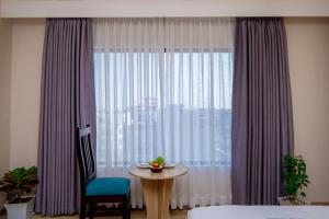 Postel nebo postele na pokoji v ubytování Velvet Luxe Hotel