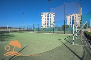 a tennis court with a soccer ball on top of it at Patacona Resort Apartments Primera Linea in Valencia