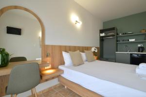 Postel nebo postele na pokoji v ubytování Hotel Akti