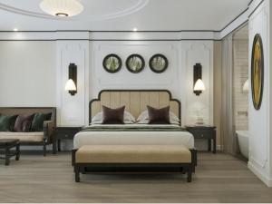a bedroom with a large bed and a bath tub at Soc Village Wellness & Retreat in Sóc Sơn +30 photos