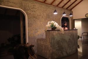 a woman is taking a picture in a mirror at Handagedara Resort & Spa in Mirissa