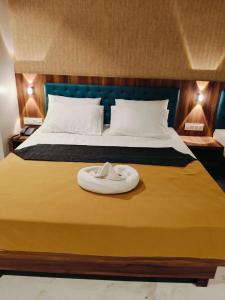 Voodi või voodid majutusasutuse Hotel Ashraya toas